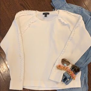 White sweatshirt with embroidered detail
